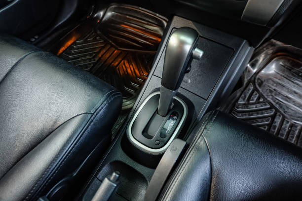 istock automatic transmission shift selector in the car interior. Closeup a manual shift of modern car gear shifter. 1295446532