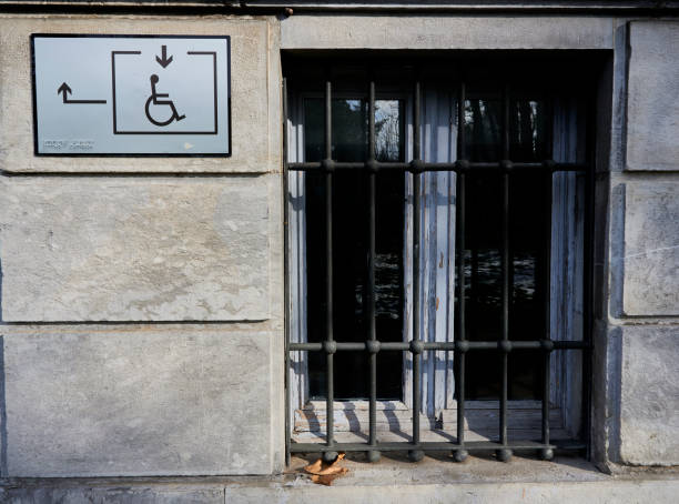 istock Indicator sign for disabled people in wheelchairs and windows 1295446808