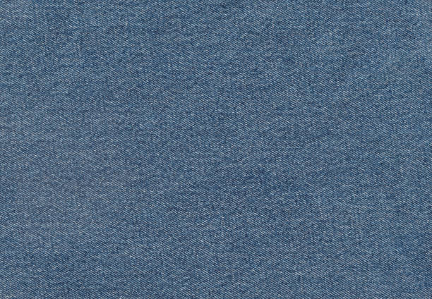 istock Fabric of old worn indigo jeans 1295450666