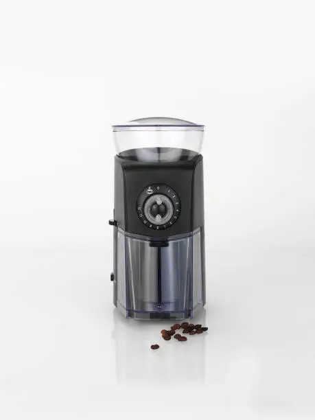 electrical coffee grinder and coffee beans isolated