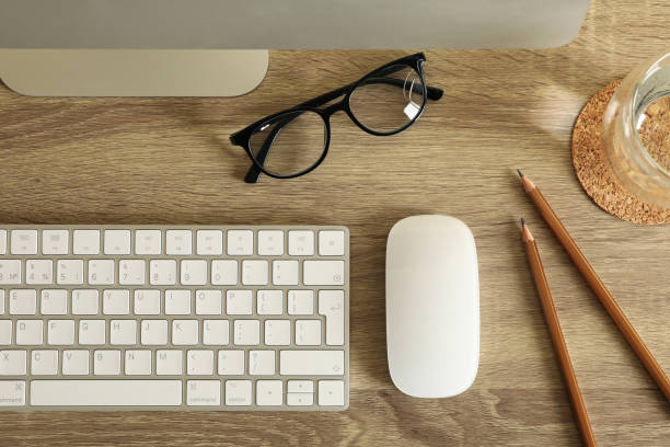 istock Concept of workplace with modern desktop computer on wooden background 1295451859