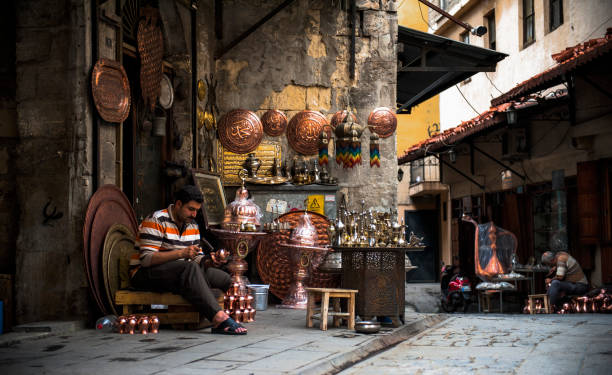 Gaziantep coppersmith bazaar Gaziantep coppersmith bazaar Gaziantep bakırcılar çarşısı Gaziantep coppersmith bazaar

Coppersmithing in Gaziantep is more than just an art form of life. Thanks to this branch of art, an important source of foreign currency enters our country. In countries that could not realize the industrial revolution, high-level products were given in coppersmiths, as in all handicrafts. Apart from our country, coppersmithing is also given importance in countries such as Egypt, Iran, India and Syria. In Gaziantep, copper work has been given great importance and even today there is a bazaar under the name of "Bakırcılar Çarşı". gaziantep city stock pictures, royalty-free photos & images