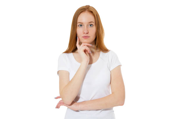 istock Thinking woman looking at camera - isolated on white 1295457211