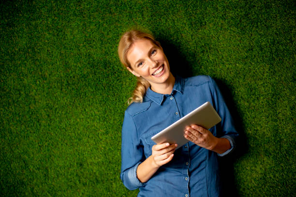 istock Young woman with digital tablet 1295457614