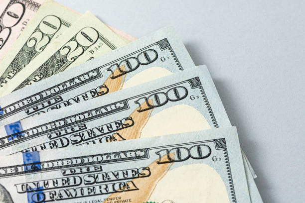istock Close up of new hundred dollar banknote corner. 1295458356