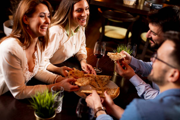 istock Young people having dinner in the restaurant 1295458597