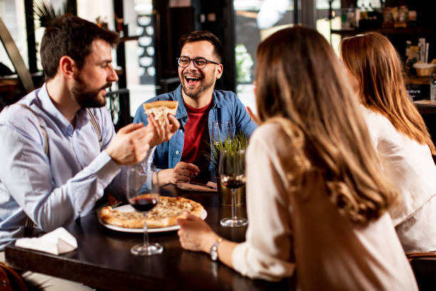 istock Young people having dinner in the restaurant 1295458598