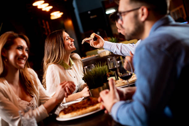 istock Young people having dinner in the restaurant 1295458599