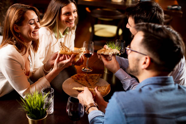 istock Young people having dinner in the restaurant 1295458602