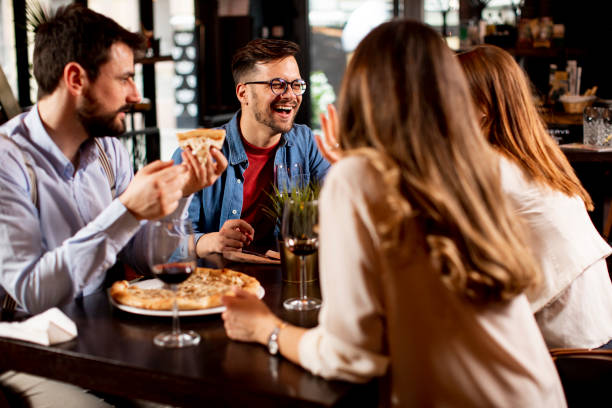 istock Young people having dinner in the restaurant 1295458604