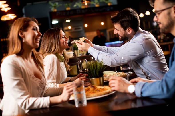 istock Young people having dinner in the restaurant 1295458612