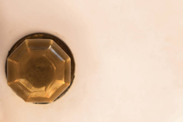 istock Closeup on a round door handle with decorative elements, door decoration 1295458653