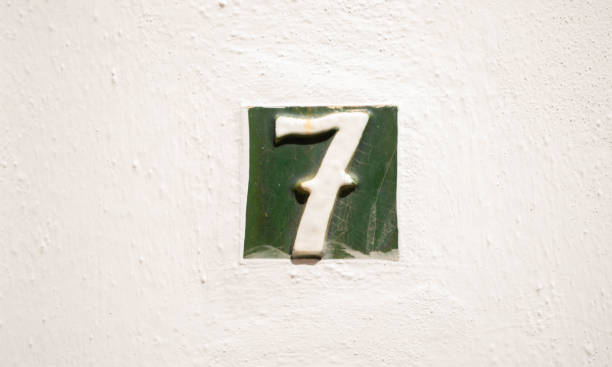 istock Decorative ceramic house number 7 tile on the wall, characteristic decorative element, 1295458672