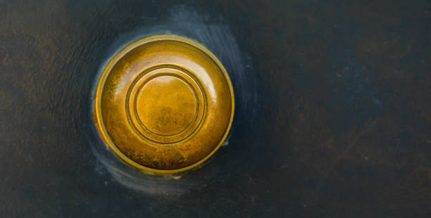 istock Closeup on a round door handle with decorative elements, door decoration 1295458709