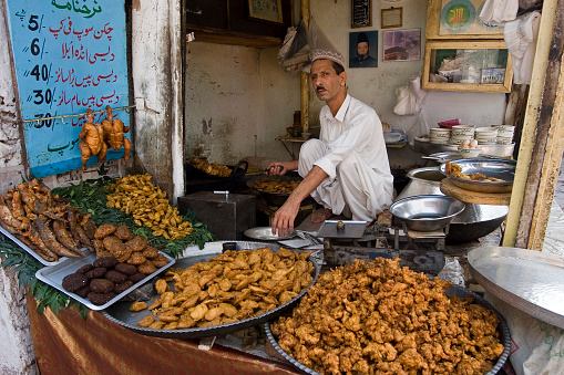 October 2, 2005. Peshawar, Pakistan.\nYou can taste different street flavors in Pakistan as in many Asian countries. Especially fried dough is one of the most popular street delicacies.
