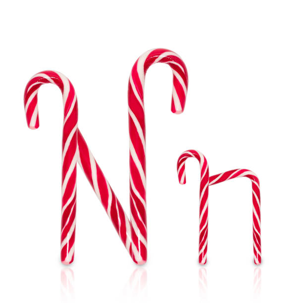 istock Candy cane in shape of letter N isolated on white background. 1295460689