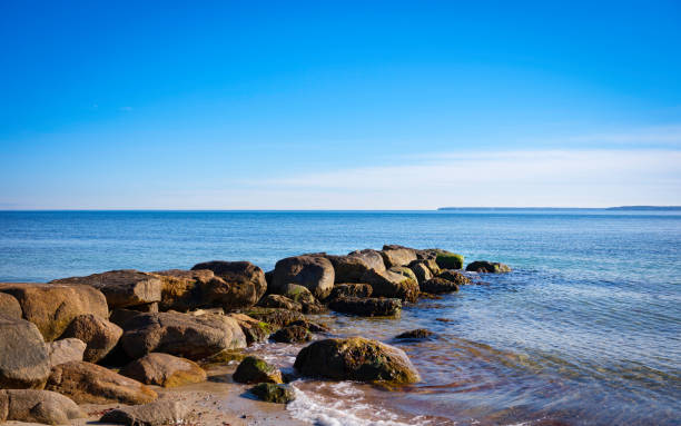 istock Ocean landscape over the jetty under blue sky 1295461734