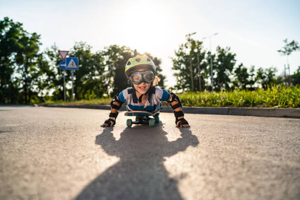 istock Little boy imagines flying on skateboard 1295462044