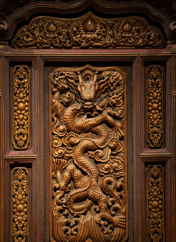 Wood carving the entrance door of traditional Javanese House called joglo