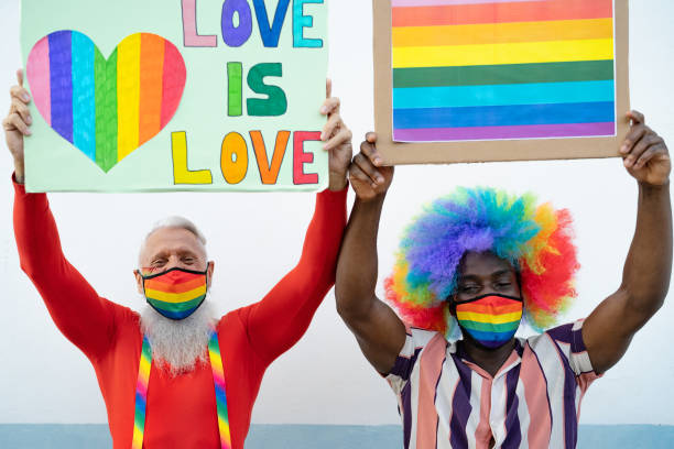 istock Activist people with different age and ethnicity protesting for gender equality - LGBT social movement concept 1295464086