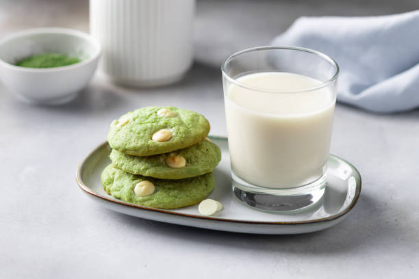 green tea matcha cookies and glass with plant based milk