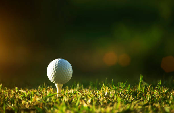 istock golf ball on tee in a beautiful golf course with morning sunshine 1295465058