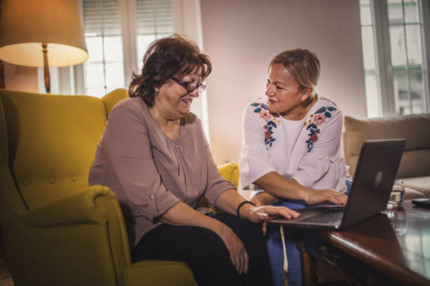 istock Woman spending time with her elderly mother 1295466442