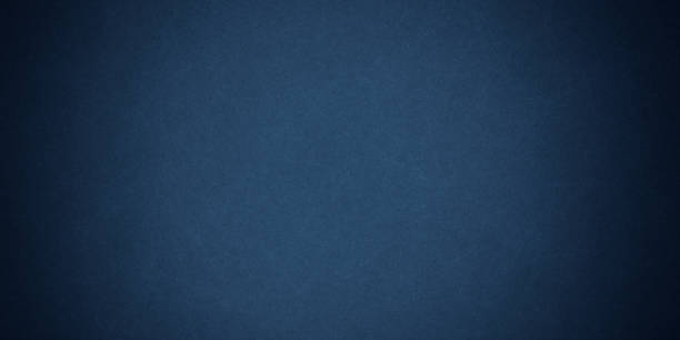 istock Texture of old navy grunge blue paper closeup 1295470133