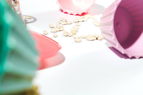 istock Colorful bowls and beans on a white background 1295476428