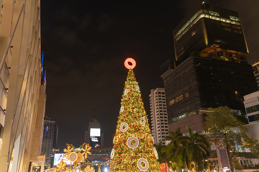 A christmas tree in Central World in Bangkok City Downtown, Thailand at night in travel in holiday vacation concept. Xmas