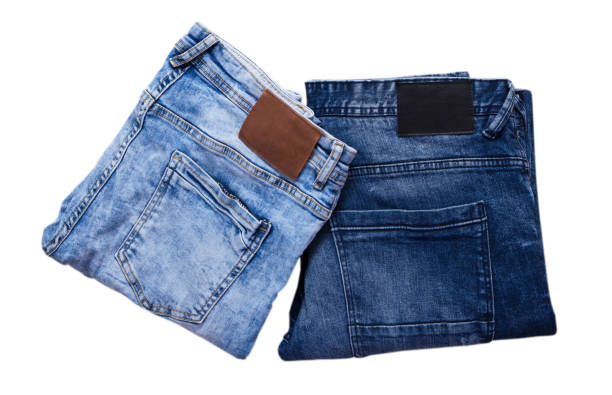 istock Folded denim, Blue and dark blue jeans on white background set or collage 1295478015