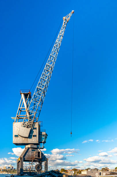 istock A vintage dock crane contrasts against a bright blue sky 1295482975