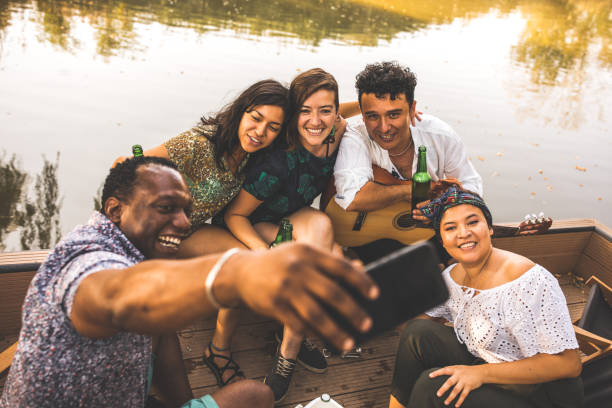 istock Joyful friends taking a selfie together while hanging out 1295483013