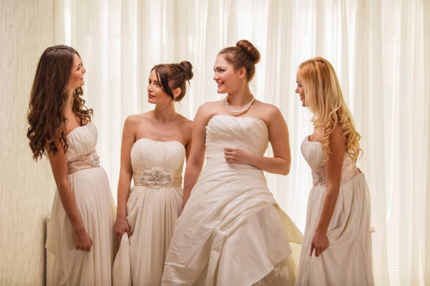 istock Group of brides smiling at each other 1295484550