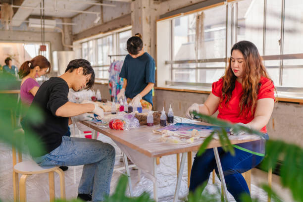 istock Group of people making tie dye together 1295490716