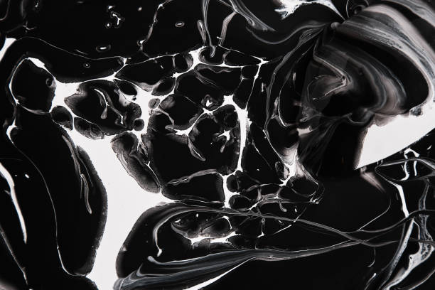 istock Black and white paint is spilled on the background. Black and white texture, and abstract textured art strokes. Minimalistic background design for graphic projects, posters, flyers, banners. 1295491444