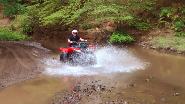 istock Hispanic man driving an off-road vehicle 1295492876