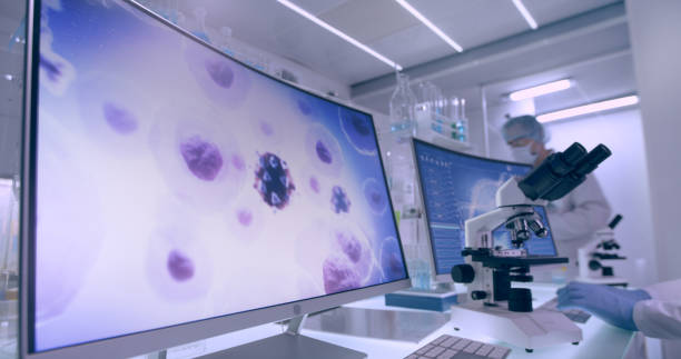istock 3D COVID-19 model - futuristic laboratory interior. Science team, during research 1295492931