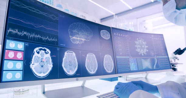 istock Laboratory equipment, microscope and computers. Brainwave research on screens. Side view of scientist 1295492968
