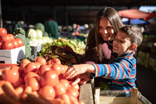 acquista locale - market farmers market agricultural fair child foto e immagini stock