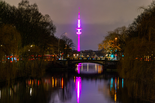 Hamburg, Germany - December 31, 2020: Purple illuminated television tower Deutschland, Europa
