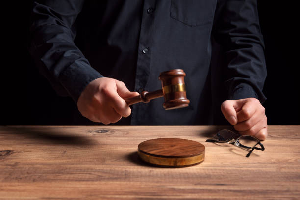 istock Male judge hand's striking the gavel 1295495915