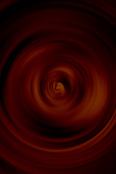 istock Abstract background of swirling sphere red and black colors. 1295496640
