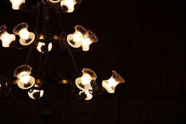 istock A large chandelier glows in the dark. Background 1295497207