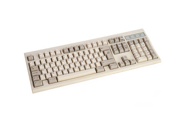 istock Cut Out Image Of An Old Computer Keyboard, Isolated On White Background 1295498257