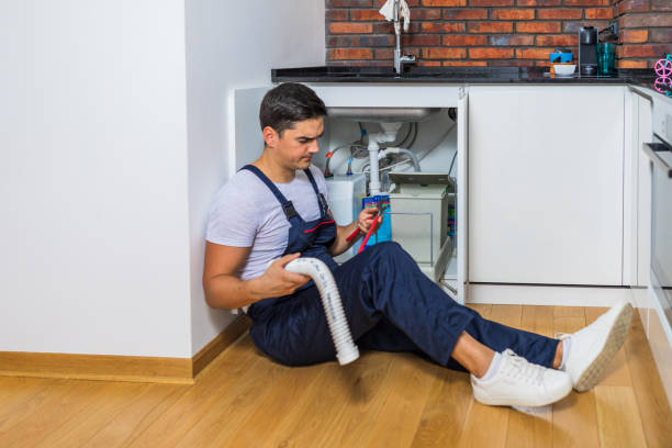 istock Plumber fixing under the sink in the kitchen 1295502015