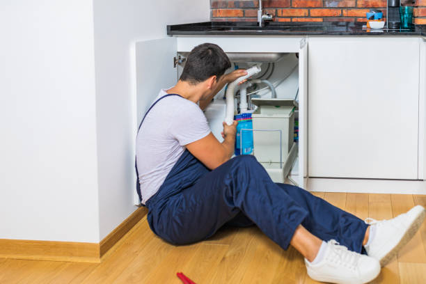 istock Plumber fixing under the sink in the kitchen 1295502018