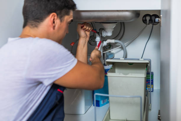 istock Plumber fixing under the sink in the kitchen 1295502019