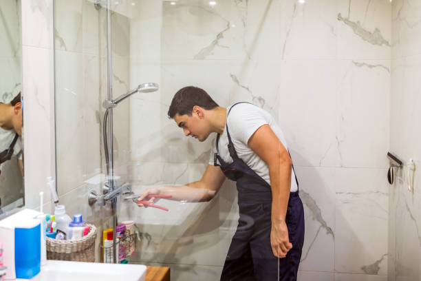 istock Plumber repairing a tap in the bathroom 1295502103
