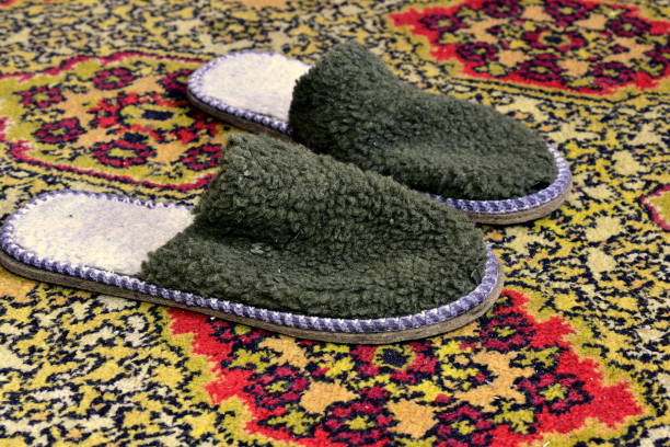 istock soft, indoor slippers on the carpet 1295503141